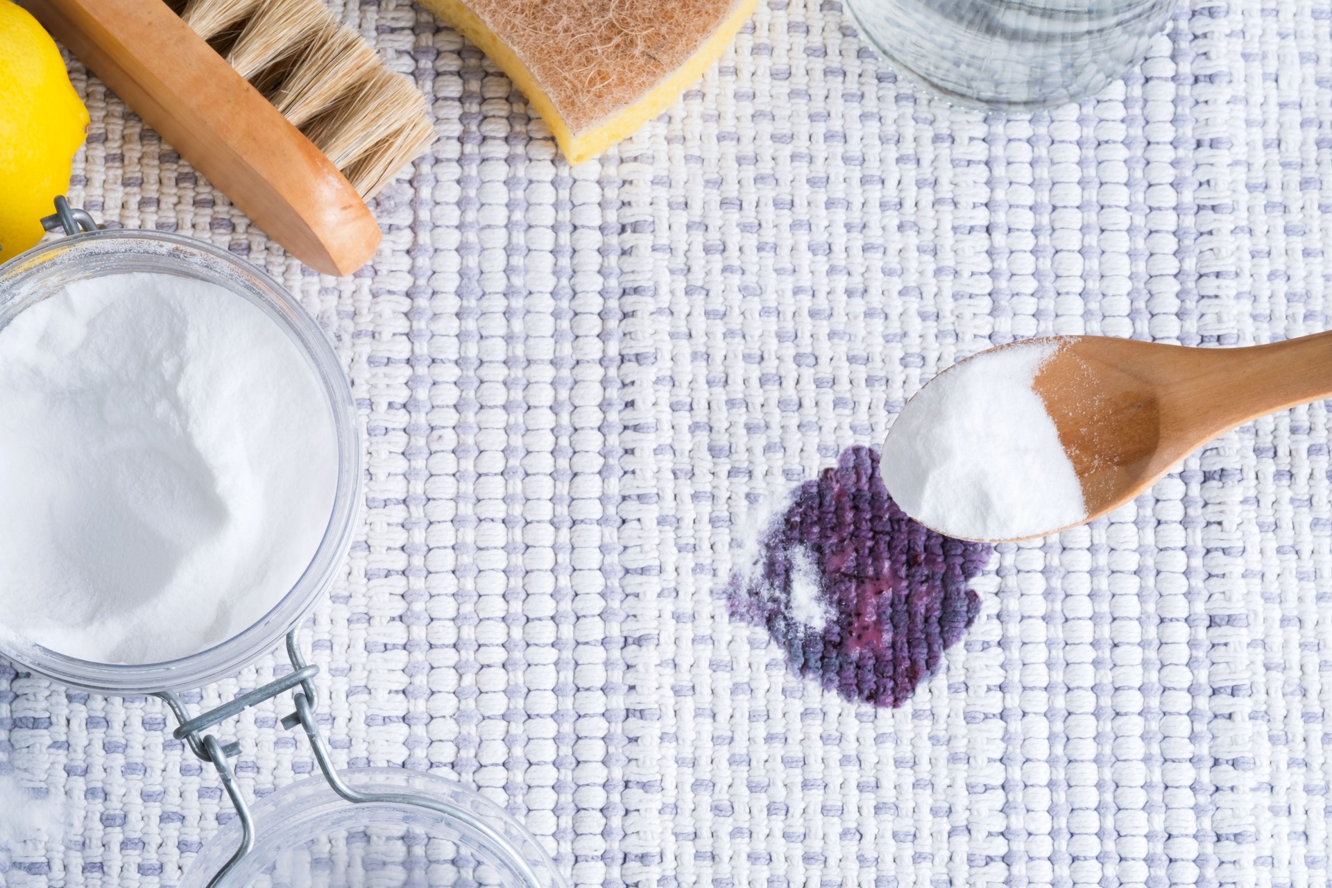Homemade eco-friendly removing of stains on a fabric sofa or rug with baking soda